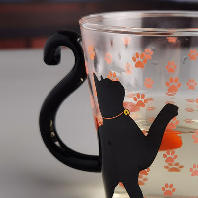 kwaliteit Borosilicaat Black Cat Tea Glass Mug met kleurrijke staartgreep fabriek